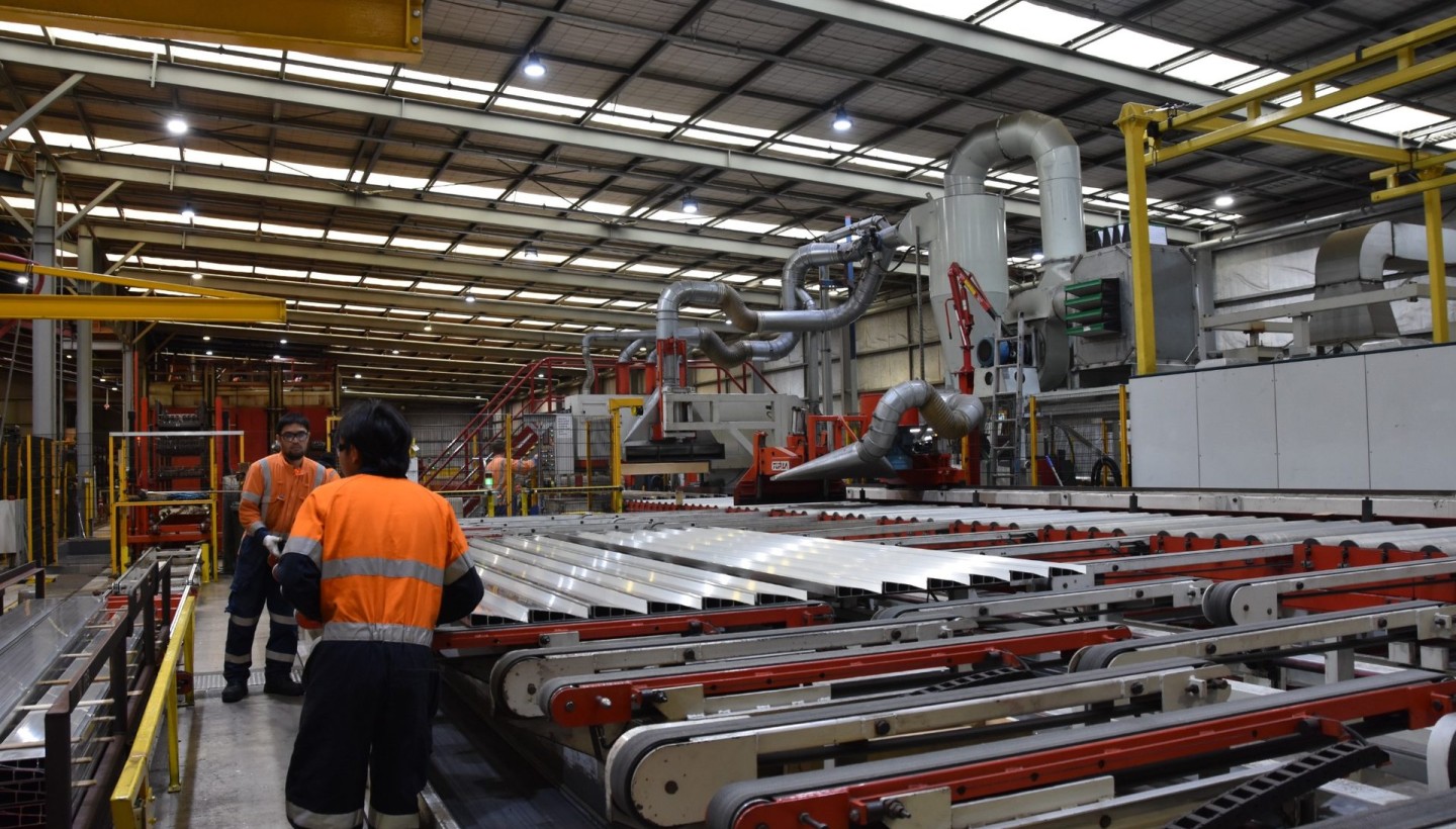 Extruded aluminium profiles on the run-out table at an extrusion plant