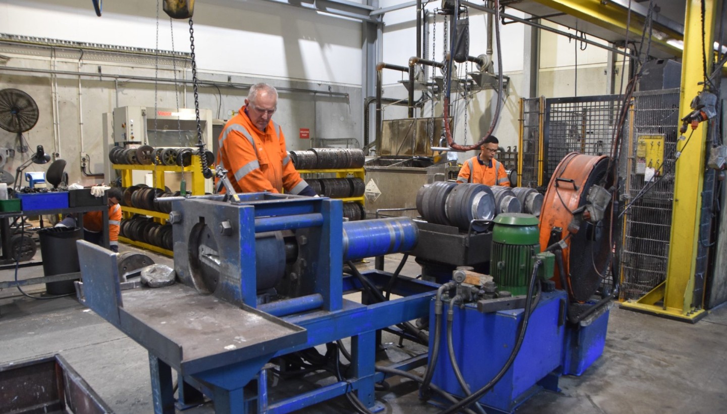 Workshop team working on aluminium extrusion die tooling